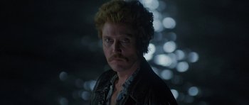 Movie still from “At Close Range” (1986), directed by James Foley – A person wearing a jacket; Close Up shot, Low angle