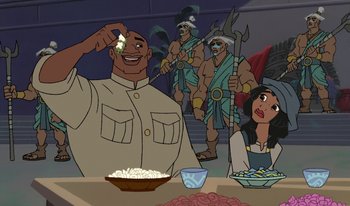 Movie still from “Atlantis: Milo's Return” (2003), directed by Tad Stones – A group of people standing around a table; Medium shot, Over the shoulder angle