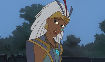 Movie still from “Atlantis: Milo's Return” (2003), directed by Tad Stones – A woman with a white and blue headdress and blue and yellow dress; Close Up shot, Over the shoulder angle