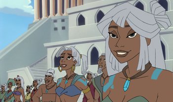 Movie still from “Atlantis: Milo's Return” (2003), directed by Tad Stones – A group of people standing next to each other in front of a building; Close Up shot, Low angle