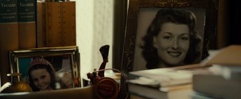 Movie still from “August: Osage County” (2013), directed by John Wells – An old picture of a young woman in a room; Extreme Close Up shot, High angle