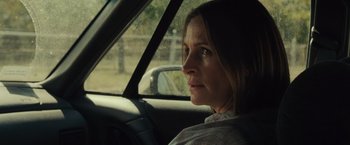 Movie still from “August: Osage County” (2013), directed by John Wells – A woman sitting in the driver's seat of a car; Close Up shot, Over the shoulder angle