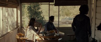 Movie still from “August: Osage County” (2013), directed by John Wells – A man and a woman sitting at a table; Wide shot, Over the shoulder angle