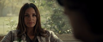 Movie still from “August: Osage County” (2013), directed by John Wells – A person sitting on a bench; Close Up shot, Over the shoulder angle