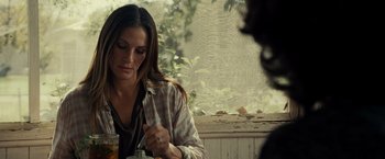 Movie still from “August: Osage County” (2013), directed by John Wells – A woman sitting in front of a window with a jar; Medium shot, Over the shoulder angle