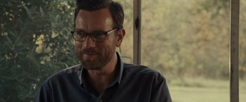 Movie still from “August: Osage County” (2013), directed by John Wells – A person wearing glasses near a window; Close Up shot, Over the shoulder angle