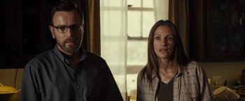 Movie still from “August: Osage County” (2013), directed by John Wells – A man and a woman standing next to each other in front of a window; Close Up shot, Over the shoulder angle