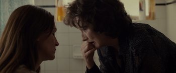 Movie still from “August: Osage County” (2013), directed by John Wells – A woman is looking at another woman in a bathroom; Close Up shot, Over the shoulder angle