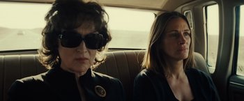 Movie still from “August: Osage County” (2013), directed by John Wells – Two women sitting in the back seat of a car; Close Up shot, Over the shoulder angle