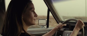 Movie still from “August: Osage County” (2013), directed by John Wells – A woman sitting in the drivers seat of a car; Close Up shot, Over the shoulder angle