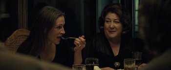 Movie still from “August: Osage County” (2013), directed by John Wells – Two women sitting at a table with wine glasses; Close Up shot, Over the shoulder angle