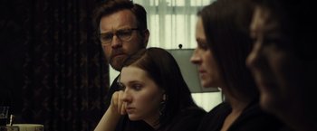 Movie still from “August: Osage County” (2013), directed by John Wells – A man and two women sitting next to each other in a room; Close Up shot, Over the shoulder angle