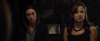 Movie still from “August: Osage County” (2013), directed by John Wells – Two women standing in front of a television; Close Up shot, Over the shoulder angle