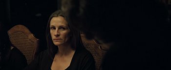 Movie still from “August: Osage County” (2013), directed by John Wells – A woman sitting in a chair looking into the distance; Close Up shot, Over the shoulder angle