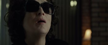 Movie still from “August: Osage County” (2013), directed by John Wells – A person wearing sunglasses; Close Up shot, Low angle