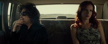 Movie still from “August: Osage County” (2013), directed by John Wells – Two people sitting in the back seat of a car; Medium shot, Over the shoulder angle