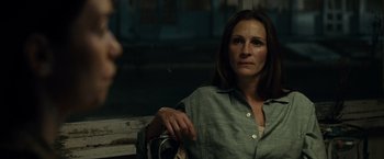 Movie still from “August: Osage County” (2013), directed by John Wells – A woman sitting on top of a wooden bench; Close Up shot, Over the shoulder angle