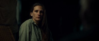 Movie still from “August: Osage County” (2013), directed by John Wells – A woman with long dark hair wearing a green shirt; Close Up shot, Low angle