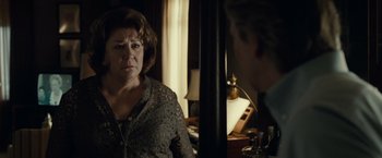 Movie still from “August: Osage County” (2013), directed by John Wells – An older woman is looking at a young man; Close Up shot, Over the shoulder angle