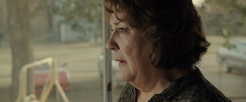 Movie still from “August: Osage County” (2013), directed by John Wells – An older woman looking out of a window; Close Up shot, Over the shoulder angle