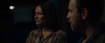 Movie still from “August: Osage County” (2013), directed by John Wells – A woman and a man are sitting in a dark room; Close Up shot, Over the shoulder angle