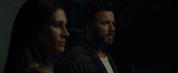 Movie still from “August: Osage County” (2013), directed by John Wells – A man and a woman standing next to each other in the dark; Close Up shot, Over the shoulder angle