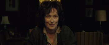 Movie still from “August: Osage County” (2013), directed by John Wells – An older woman is sitting in front of a mirror; Close Up shot, Low angle