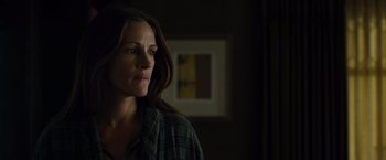Movie still from “August: Osage County” (2013), directed by John Wells – A person with long dark hair; Close Up shot, Over the shoulder angle