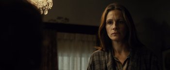 Movie still from “August: Osage County” (2013), directed by John Wells – A person standing in front of a window; Close Up shot, Low angle