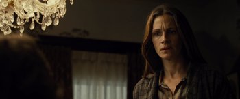 Movie still from “August: Osage County” (2013), directed by John Wells – A person in a room near a window; Close Up shot, Low angle