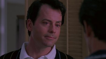 Movie still from “Auto Focus” (2002), directed by Paul Schrader – A man with a goatee is looking into the distance; Close Up shot, Over the shoulder angle