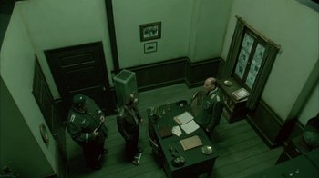 Movie still from “Auto Focus” (2002), directed by Paul Schrader – A group of men sitting around a table; Wide shot, High angle