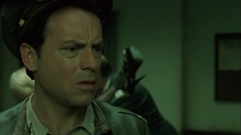 Movie still from “Auto Focus” (2002), directed by Paul Schrader – A person wearing a hat; Close Up shot, Low angle