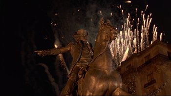 Movie still from “Avalon” (1990), directed by Barry Levinson – A statue of a man on a horse with fireworks in the background; Extreme Wide shot, Low angle