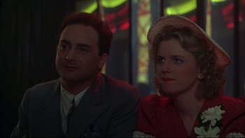 Movie still from “Avalon” (1990), directed by Barry Levinson – A man and a woman sitting next to each other; Close Up shot, Low angle