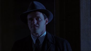 Movie still from “Avalon” (1990), directed by Barry Levinson – A man wearing a hat and a suit; Close Up shot, Low angle
