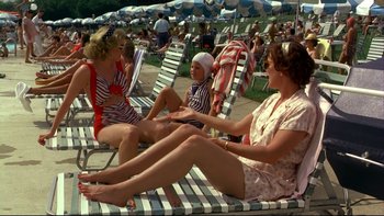 Movie still from “Avalon” (1990), directed by Barry Levinson – A group of women sitting on lounge chairs; Wide shot, High angle