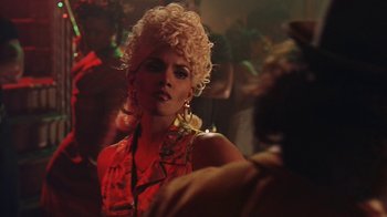 Movie still from “B*A*P*S” (1997), directed by Robert Townsend – A woman in a red dress with blonde curly hair; Close Up shot, Low angle