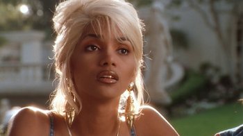 Movie still from “B*A*P*S” (1997), directed by Robert Townsend – A person with long blonde hair; Close Up shot, High angle
