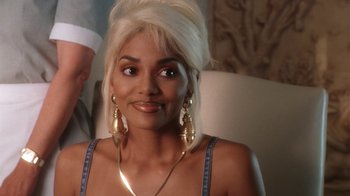 Movie still from “B*A*P*S” (1997), directed by Robert Townsend – A person wearing a necklace; Close Up shot, High angle