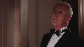 Movie still from “B*A*P*S” (1997), directed by Robert Townsend – An older man in a tuxedo looking off into the distance; Close Up shot, Low angle