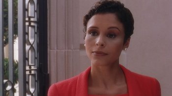 Movie still from “B*A*P*S” (1997), directed by Robert Townsend – A person wearing a suit and tie; Close Up shot, High angle