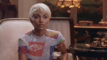 Movie still from “B*A*P*S” (1997), directed by Robert Townsend – A person sitting in a chair; Close Up shot, High angle