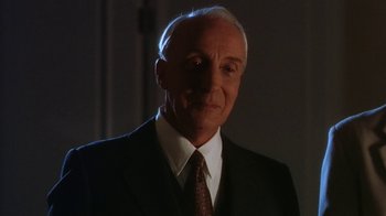 Movie still from “B*A*P*S” (1997), directed by Robert Townsend – An older man wearing a suit and tie; Close Up shot, Low angle