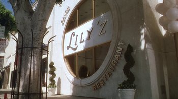 Movie still from “B*A*P*S” (1997), directed by Robert Townsend – A building that has a sign on the side of it; Extreme Wide shot, High angle