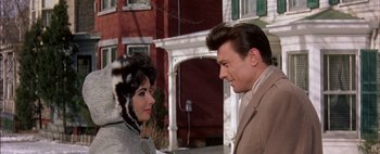 Movie still from “BUtterfield 8” (1960), directed by Daniel Mann – A man and a woman standing next to each other; Close Up shot, Over the shoulder angle