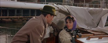 Movie still from “BUtterfield 8” (1960), directed by Daniel Mann – A man and a woman are talking to each other; Close Up shot, Over the shoulder angle