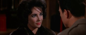 Movie still from “BUtterfield 8” (1960), directed by Daniel Mann – A person wearing a jacket; Close Up shot, Over the shoulder angle