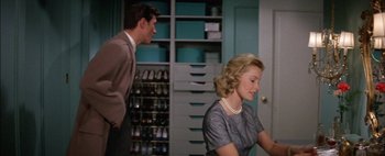 Movie still from “BUtterfield 8” (1960), directed by Daniel Mann – A man and a woman are in a room; Medium shot, Low angle