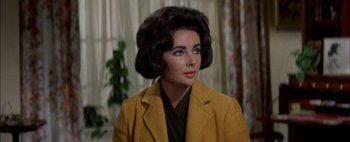 Movie still from “BUtterfield 8” (1960), directed by Daniel Mann – A person wearing a suit and tie; Close Up shot, Over the shoulder angle